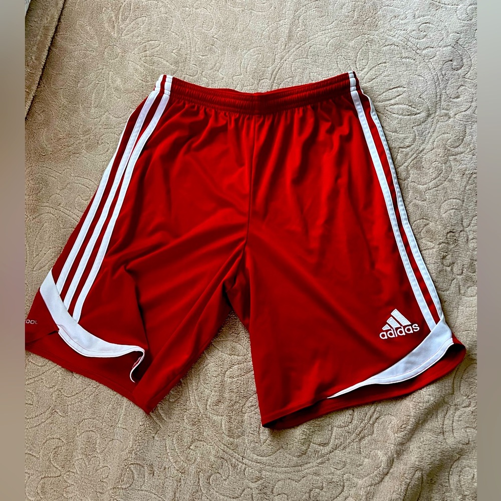 Adidas red shorts.
